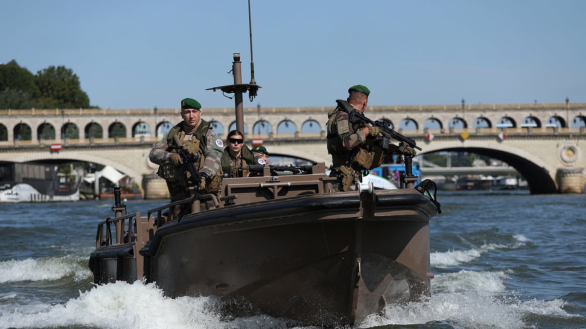 Soldiers patrol on the Seine river, Wednesday, July 17, 2024 in Paris. France's armed forces held a demonstration of the security measures planned on the River Seine, both in and out of the water, to make it safe for athletes and spectators during the opening ceremony of the Paris Olympics. Organizers have planned a parade of about 10,000 athletes through the heart of the French capital on boats on the Seine along a 6-kilometer (3.7-mile) route at sunset on July 26. 

 - (AP Photo/Aurelien Morissard)
